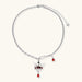 Eco-brass crown pendant necklace with red enamel details and dangling zirconia stone on chunky adjustable chain