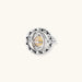 Adjustable brass ring with rotating zirconia center, surrounded by black enamel celestial stars and moon details