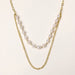 Layered gold chain necklace with organic baroque freshwater pearls and adjustable length on cream background