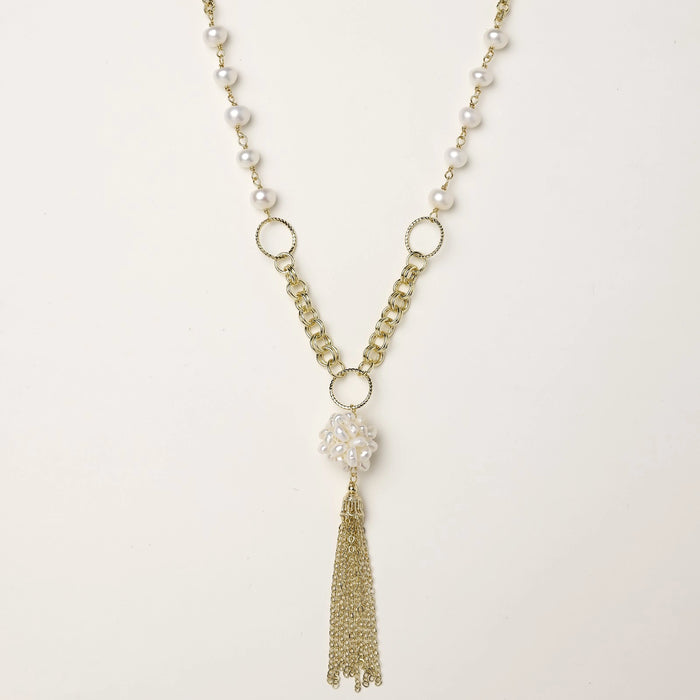 Long gold-plated necklace with freshwater pearls, chunky chain links, and flowing tassel pendant