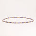 Delicate 18K gold vermeil necklace with alternating lavender zirconia beads and white freshwater pearls on cream background
