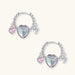 Silver chain hoop earrings with iridescent opal heart charms and pink zirconia accents on white background