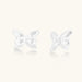 Pair of translucent butterfly-shaped stud earrings with frosted finish and dimensional wing details on white background