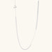 Long sterling silver beaded necklace with graduated sphere design, toggle clasp, and delicate chain extension on white background
