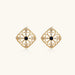 Gold filigree stud earrings with navy lapis lazuli center stone and mother-of-pearl accents in ornate quatrefoil design