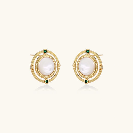 Circular gold stud earrings with iridescent mother-of-pearl center and green zirconia accents on cream background.