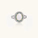 Vintage-style cocktail ring with luminous cat's eye center stone surrounded by turquoise and crystal double halo on white gold plated band