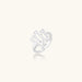 Sculptural sterling silver ring with organic branch design and textured surfaces on cream background