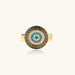 Gold chain ring with Greek key border and turquoise evil eye center on white background
